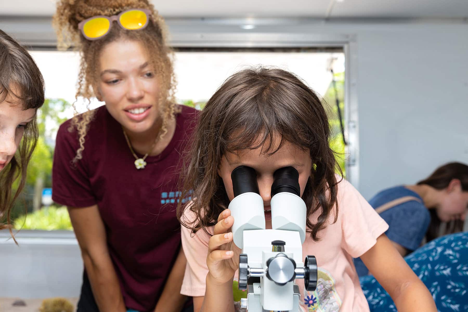 image of girl looking through binoculars