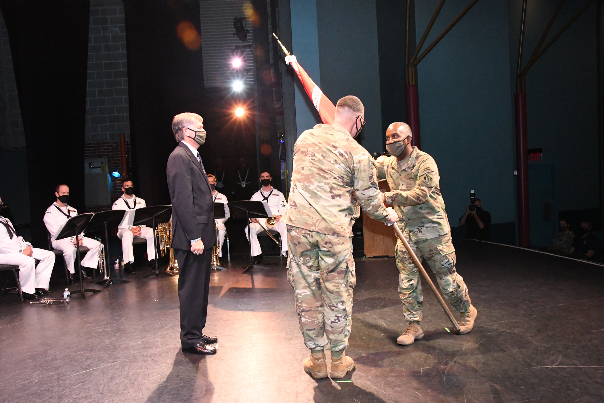 Brigadier General Jason E. Kelly, Commanding General, U.S. Army Corps of Engineers South Atlantic Division, (Right) passes the Jacksonville District flag to Col. James L. Booth (Left) as he took command of the Jacksonville District during a change of command ceremony Sept 9, 2021 at the at the Terry Theater, Times Union Center, Jacksonville. (USACE photo by Mark Rankin)