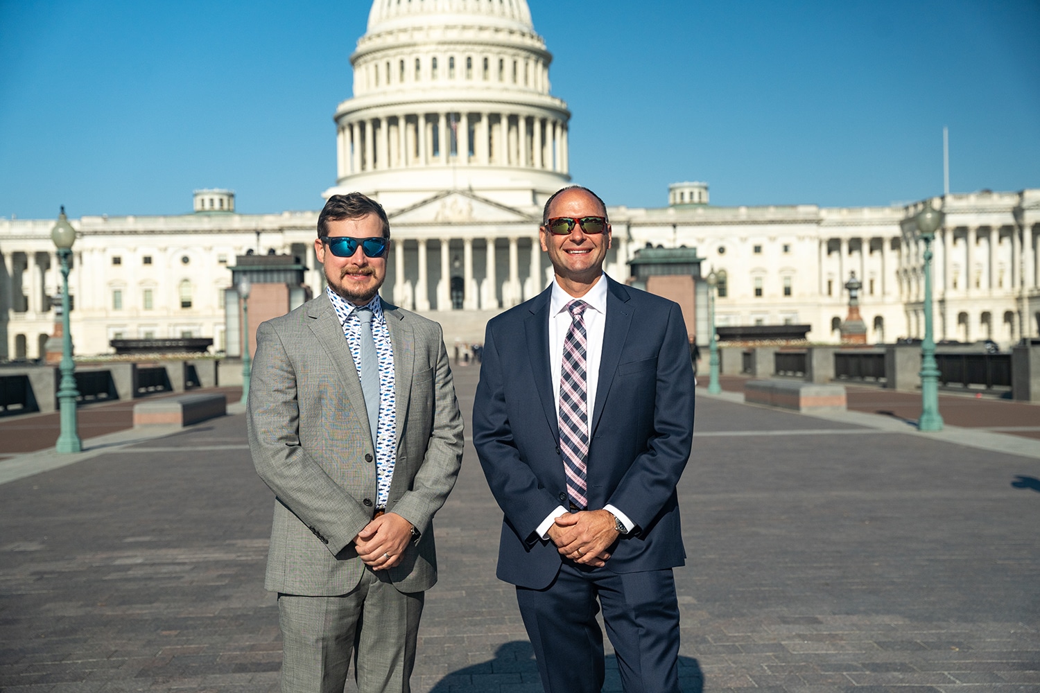 image of two men in front of capitol hill