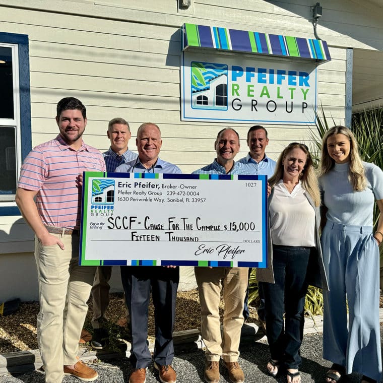 pfeifer realty group presents check to sccf