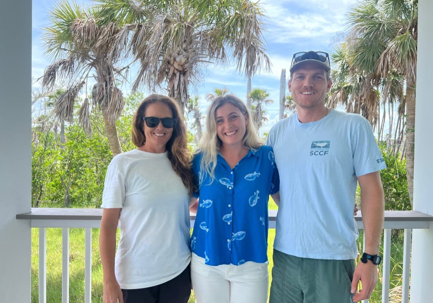 image of three people smiling outdoors